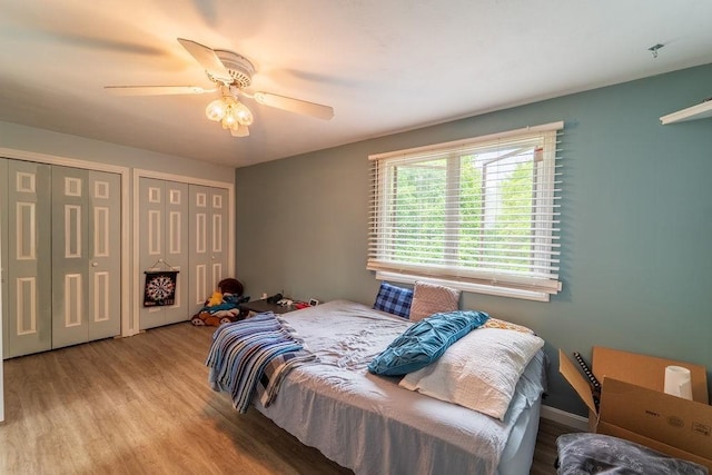 7 Tamarac Dr Unit F, Smithfield, RI 02828 - bedroom featuring multiple closets, wood finished floors, and ceiling fan