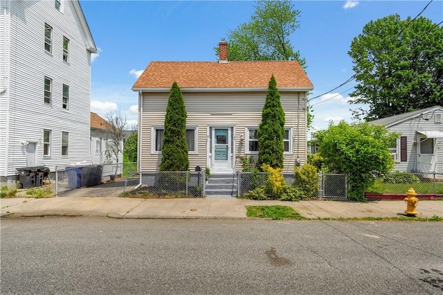 24 Kepler St, Pawtucket, RI 02860 - view of front of home featuring a chimney and entry steps