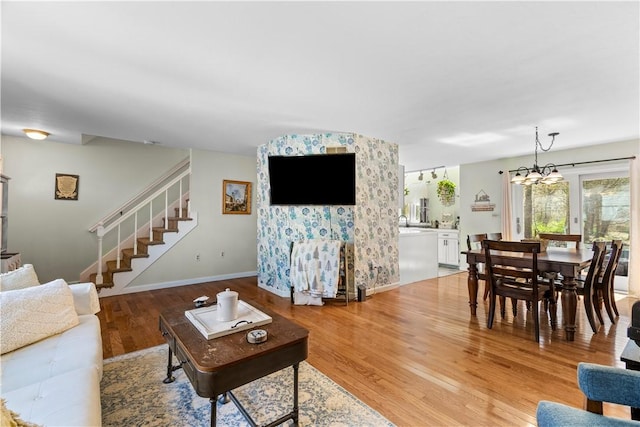 447 Stafford Rd Unit C3, Tiverton, RI 02878 - living area with stairs, light wood-style flooring, and a chandelier