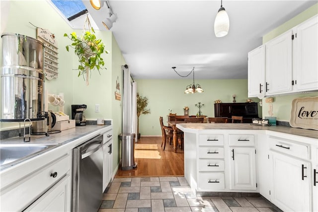 447 Stafford Rd Unit C3, Tiverton, RI 02878 - kitchen featuring dishwasher, a peninsula, white cabinetry, and decorative light fixtures