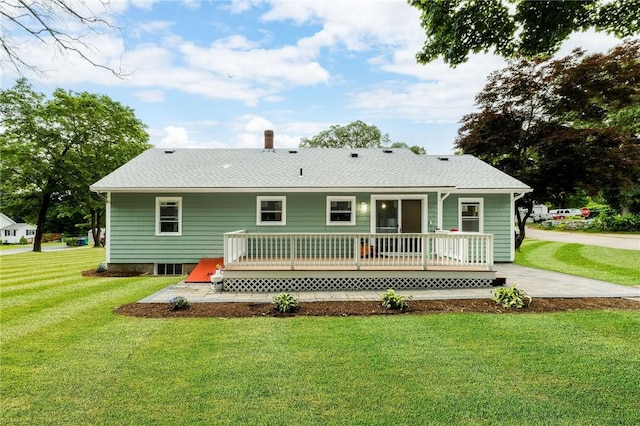 65 Harrop Ave, Warwick, RI 02886 - back of house featuring a wooden deck, a lawn, and a chimney
