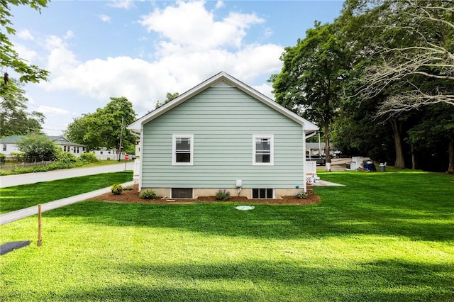 65 Harrop Ave, Warwick, RI 02886 - view of property exterior featuring a lawn