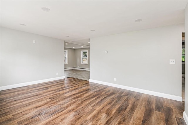 65 Harrop Ave, Warwick, RI 02886 - spare room with wood finished floors, recessed lighting, and a baseboard radiator