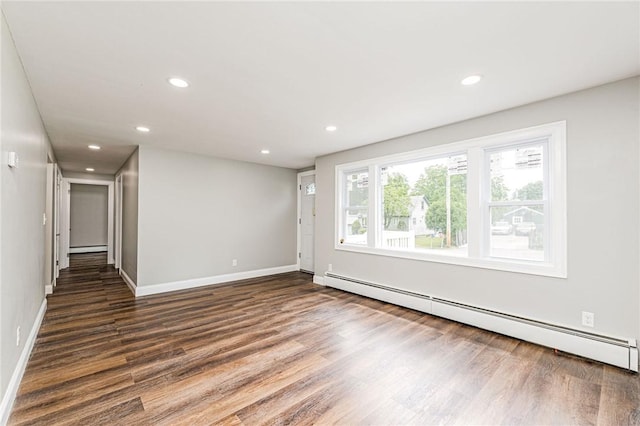65 Harrop Ave, Warwick, RI 02886 - empty room featuring a baseboard radiator, wood finished floors, recessed lighting, and baseboard heating
