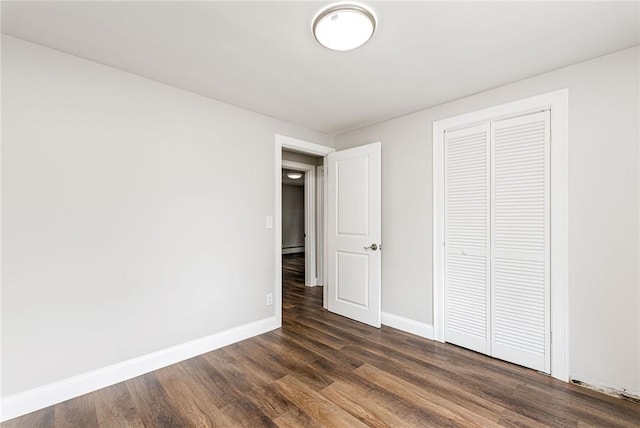 65 Harrop Ave, Warwick, RI 02886 - unfurnished bedroom featuring dark wood-type flooring and a closet