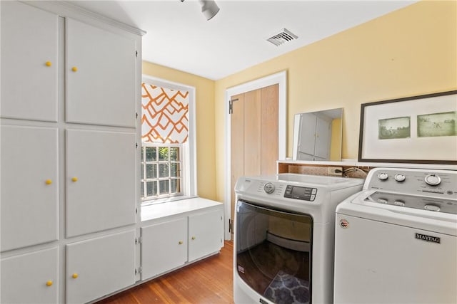 35 Second St, Newport, RI 02840 - laundry room with washing machine and clothes dryer, cabinet space, and light wood-type flooring