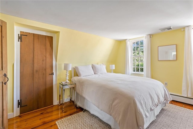 35 Second St, Newport, RI 02840 - bedroom featuring wood finished floors and baseboard heating