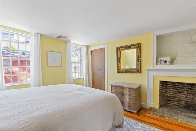35 Second St, Newport, RI 02840 - bedroom featuring wood finished floors and a fireplace