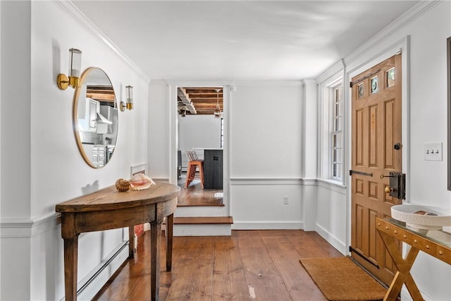 35 Second St, Newport, RI 02840 - entrance foyer with wood-type flooring, crown molding, and baseboard heating