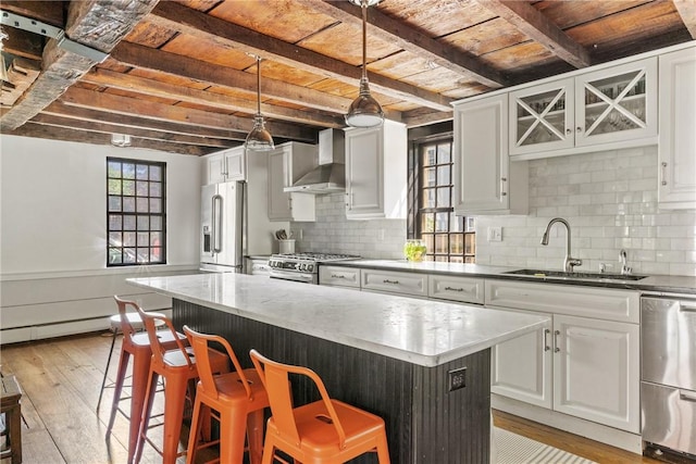 35 Second St, Newport, RI 02840 - kitchen featuring wall chimney range hood, premium appliances, light wood-style floors, a wooden ceiling with exposed beams, and a kitchen bar