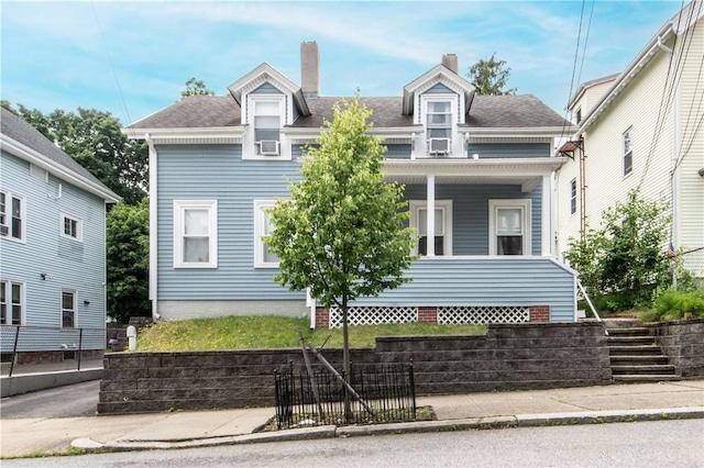 40 Highland St, Pawtucket, RI 02860 - view of front facade with a chimney and covered porch