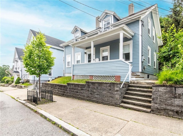 40 Highland St, Pawtucket, RI 02860 - view of front of property featuring a chimney and a porch