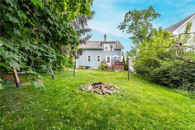 40 Highland St, Pawtucket, RI 02860 - view of grassy yard featuring a fire pit and a wooden deck