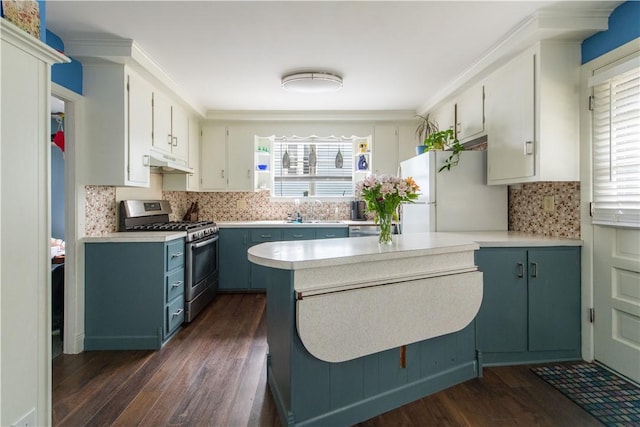 40 Highland St, Pawtucket, RI 02860 - kitchen with stainless steel gas range, freestanding refrigerator, under cabinet range hood, and dark wood-type flooring