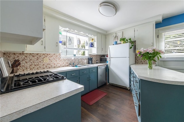 40 Highland St, Pawtucket, RI 02860 - kitchen featuring appliances with stainless steel finishes, healthy amount of natural light, light countertops, dark wood-type flooring, and ornamental molding