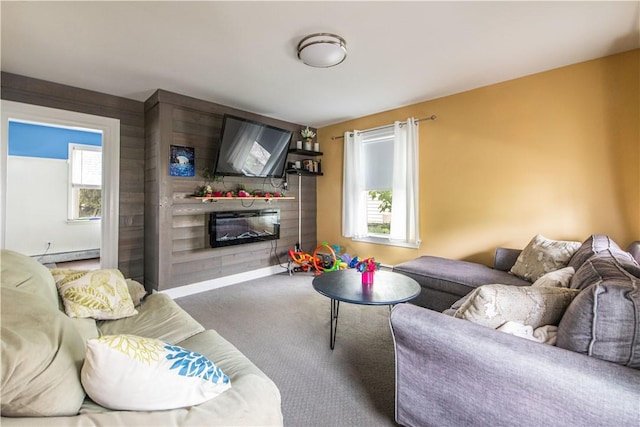 40 Highland St, Pawtucket, RI 02860 - carpeted living room with a baseboard heating unit and a glass covered fireplace