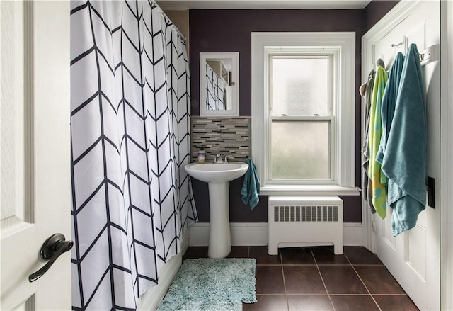 40 Highland St, Pawtucket, RI 02860 - bathroom featuring radiator heating unit, tile patterned floors, plenty of natural light, and curtained shower