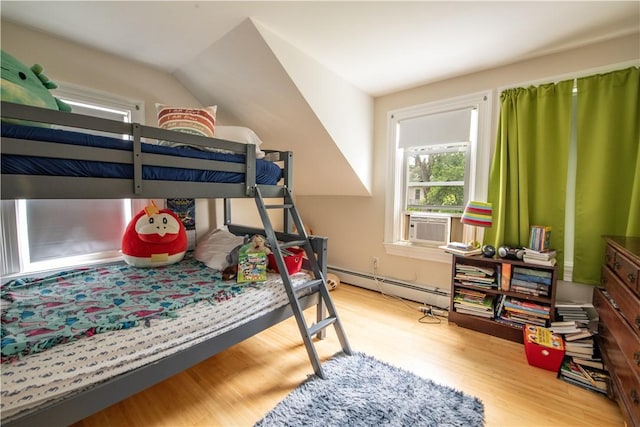 40 Highland St, Pawtucket, RI 02860 - bedroom with a baseboard radiator, wood finished floors, and cooling unit