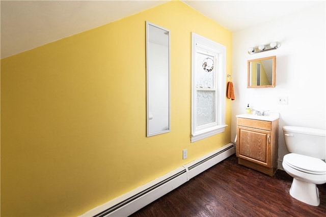 40 Highland St, Pawtucket, RI 02860 - half bath featuring a baseboard radiator, vanity, and wood finished floors