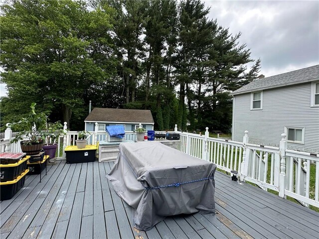 25 Eddy St, West Warwick, RI 02893 - wooden deck featuring a storage shed and view of scattered trees