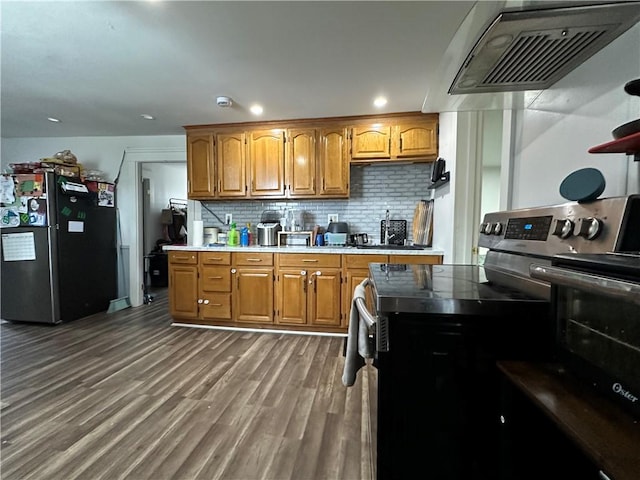 25 Eddy St, West Warwick, RI 02893 - kitchen featuring freestanding refrigerator, range with electric cooktop, ventilation hood, decorative backsplash, and brown cabinets