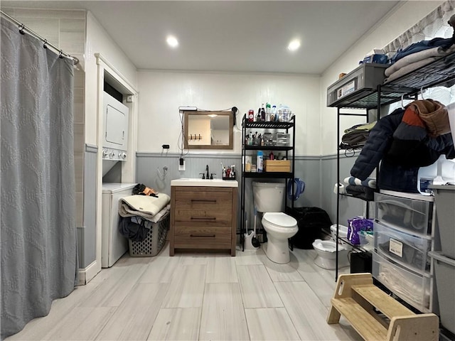 25 Eddy St, West Warwick, RI 02893 - bathroom featuring stacked washing machine and dryer, vanity, a shower with shower curtain, and recessed lighting
