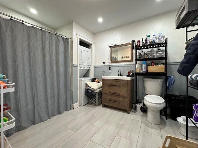 25 Eddy St, West Warwick, RI 02893 - bathroom featuring stacked washer and clothes dryer, vanity, a shower with shower curtain, and recessed lighting