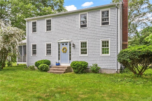 373 Fletcher Rd, North Kingstown, RI 02852 - colonial-style house with a front lawn and a chimney