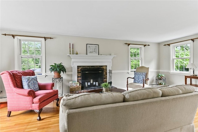 373 Fletcher Rd, North Kingstown, RI 02852 - living area with wood finished floors and a fireplace