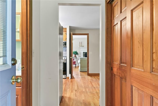 373 Fletcher Rd, North Kingstown, RI 02852 - hall featuring light wood finished floors and baseboards