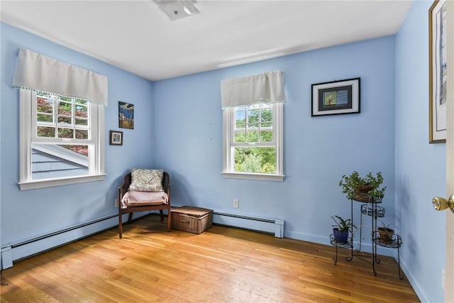 373 Fletcher Rd, North Kingstown, RI 02852 - sitting room featuring a baseboard radiator and light wood-style flooring