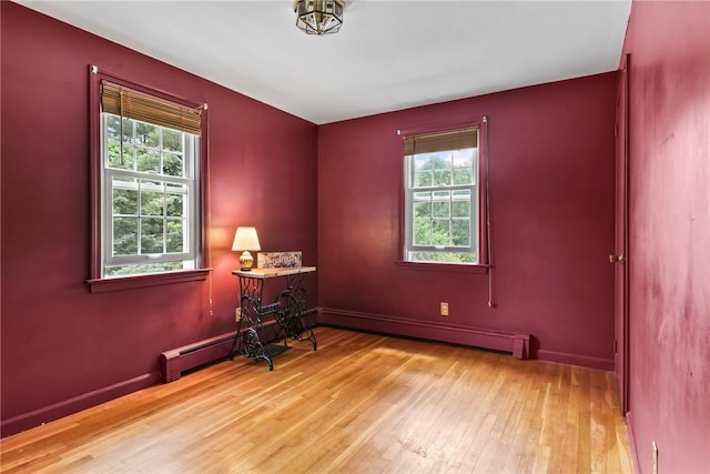 373 Fletcher Rd, North Kingstown, RI 02852 - unfurnished room featuring wood-type flooring and baseboard heating