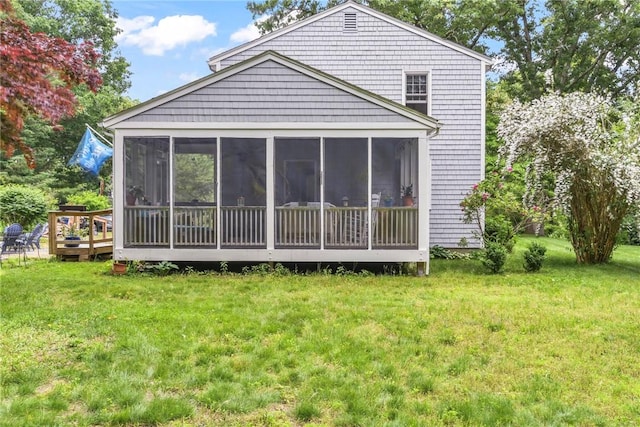 373 Fletcher Rd, North Kingstown, RI 02852 - back of property with a sunroom and a lawn