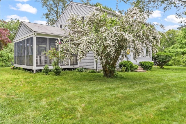 373 Fletcher Rd, North Kingstown, RI 02852 - rear view of property with a sunroom and a lawn