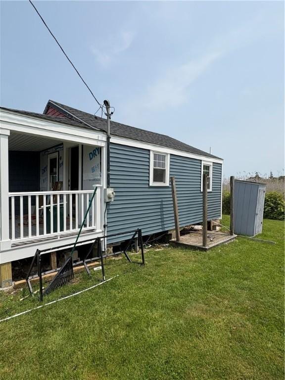 854 Matunuck Beach Rd, South Kingstown, RI 02879 - back of house with a yard and covered porch