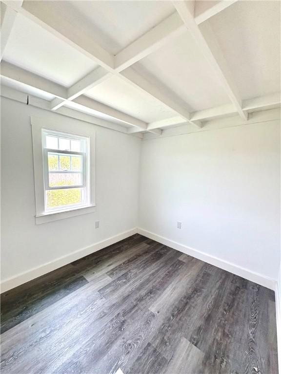 854 Matunuck Beach Rd, South Kingstown, RI 02879 - spare room with dark wood-style floors, beamed ceiling, and coffered ceiling