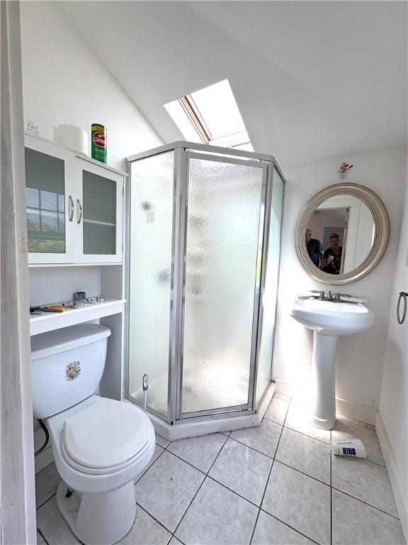 854 Matunuck Beach Rd, South Kingstown, RI 02879 - full bath featuring a skylight, a stall shower, tile patterned flooring, and lofted ceiling