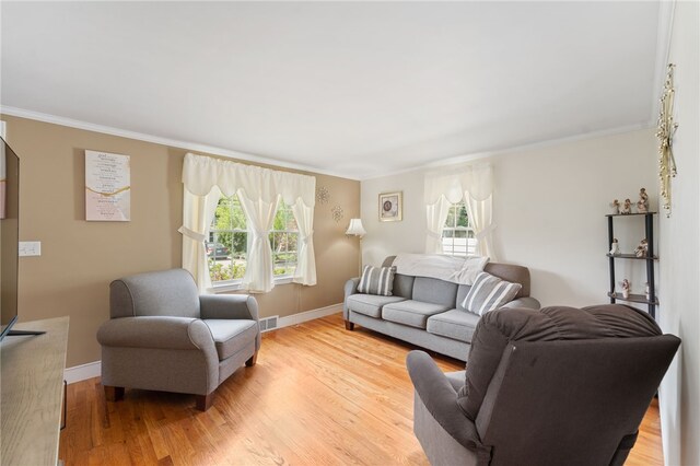 59 Massachusetts Ave, Warwick, RI 02888 - living area with plenty of natural light, crown molding, and light wood-type flooring