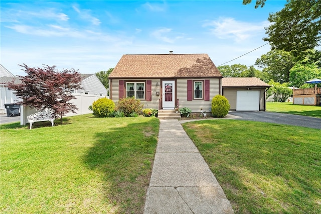 59 Massachusetts Ave, Warwick, RI 02888 - new england style home featuring asphalt driveway, roof with shingles, and an outbuilding