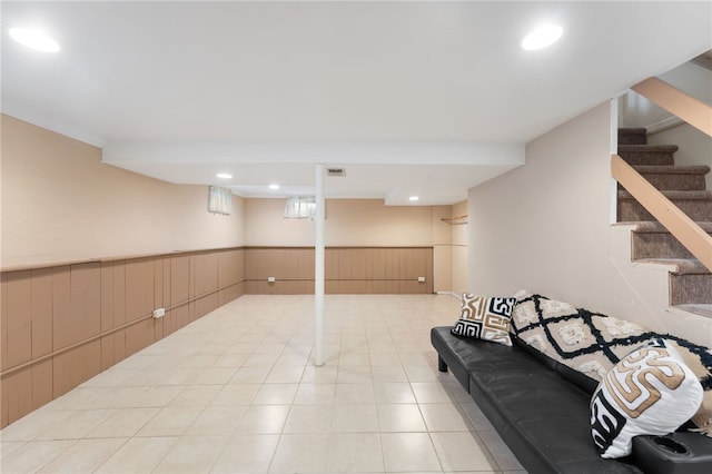 59 Massachusetts Ave, Warwick, RI 02888 - finished basement featuring a wainscoted wall, stairs, light tile patterned floors, wood walls, and recessed lighting