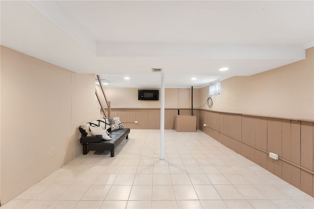 59 Massachusetts Ave, Warwick, RI 02888 - finished below grade area with a wainscoted wall, wood walls, and light tile patterned floors