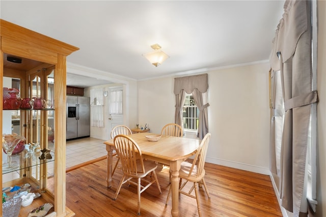 59 Massachusetts Ave, Warwick, RI 02888 - dining area with light wood finished floors and crown molding