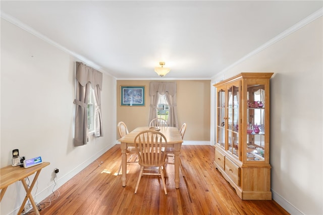 59 Massachusetts Ave, Warwick, RI 02888 - dining area featuring light wood-type flooring and crown molding