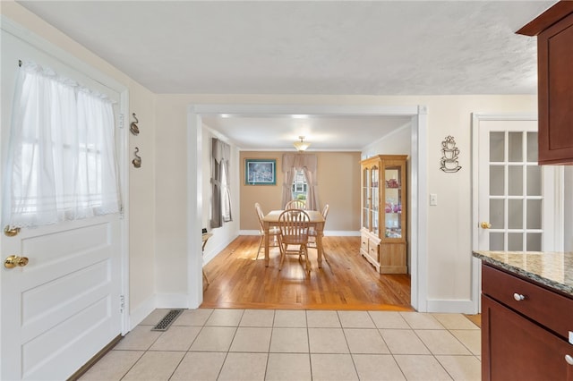 59 Massachusetts Ave, Warwick, RI 02888 - dining room with light tile patterned flooring and baseboards