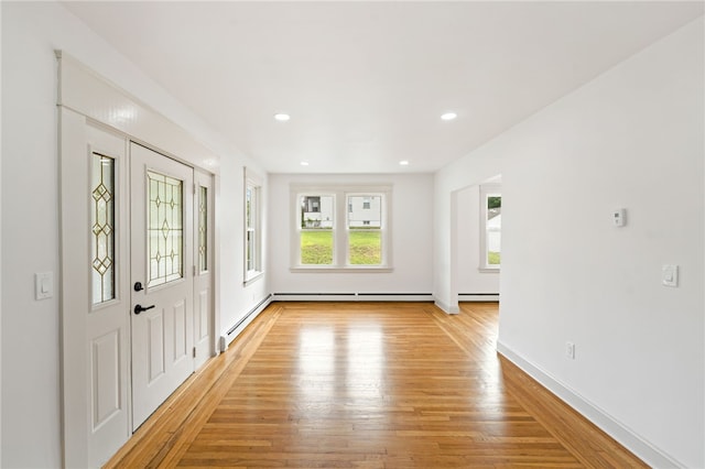 1314 Chalkstone Ave, Providence, RI 02908 - foyer entrance featuring light wood finished floors, recessed lighting, a baseboard heating unit, and baseboard heating