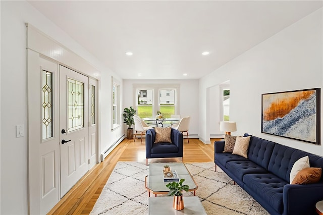 1314 Chalkstone Ave, Providence, RI 02908 - living room featuring baseboard heating, light wood finished floors, recessed lighting, and a baseboard radiator