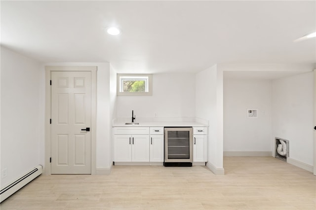 1314 Chalkstone Ave, Providence, RI 02908 - indoor wet bar with wine cooler, a baseboard radiator, light wood-style flooring, and recessed lighting