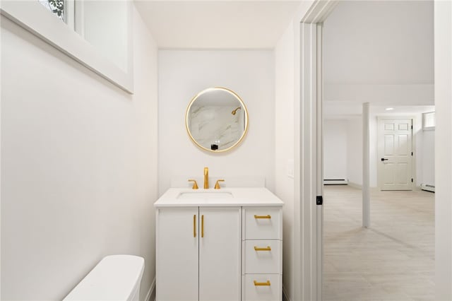 1314 Chalkstone Ave, Providence, RI 02908 - half bathroom with vanity and baseboard heating