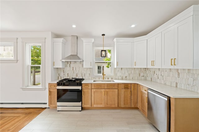 1314 Chalkstone Ave, Providence, RI 02908 - kitchen featuring stainless steel appliances, wall chimney range hood, a baseboard radiator, tasteful backsplash, and recessed lighting
