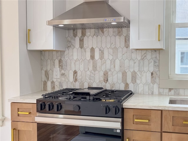 1314 Chalkstone Ave, Providence, RI 02908 - kitchen with black gas stove, extractor fan, backsplash, and light stone counters